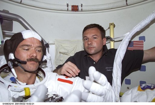 MS Lonchakov helps MS Hadfield with his EMU before the first EVA of STS-100