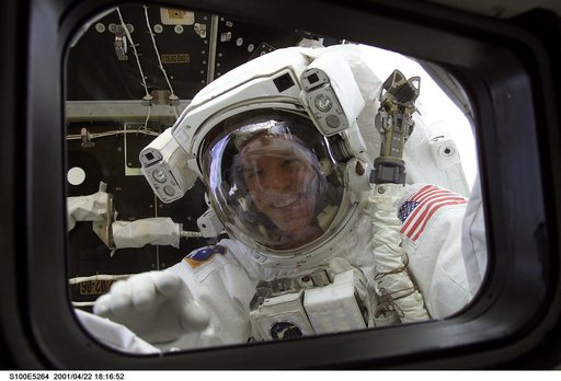 MS Parazynski looks in on his fellow crewmembers during the first EVA of STS-100