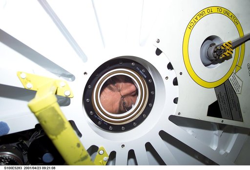 Expedition Two's Jim Voss looks through the PMA2 window minutes before the STS-100 ingress