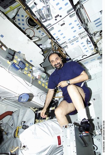 MS Guidoni exercises on the cycle ergometer on the middeck of Endeavour