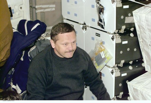 MS Boris Morukov at work aboard Atlantis during STS-106