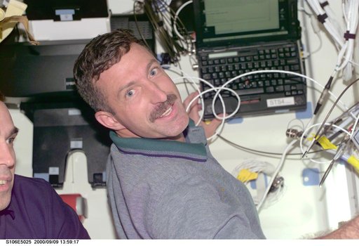 MS Burbank and MS Mastracchio at work aboard Atlantis during STS-106