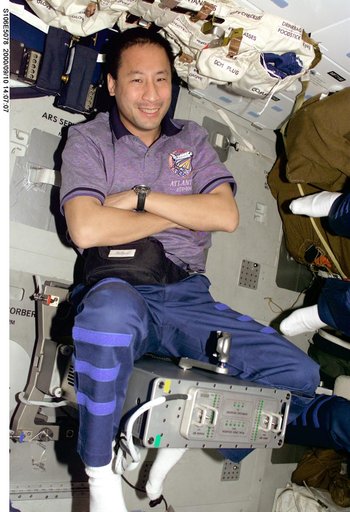 MS Lu poses for a photo aboard Atlantis during STS-106