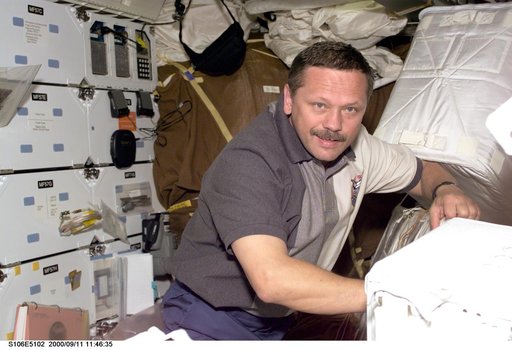 MS Morukov works onboard Atlantis during STS-106