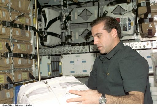 MS Mastracchio works with stowage bags in SpaceHab during STS-106