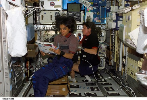 Chawla and Clark in the Spacehab RDM during activation procedures on STS-107