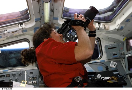 Clark videotapes through an AFD window on Columbia during STS-107