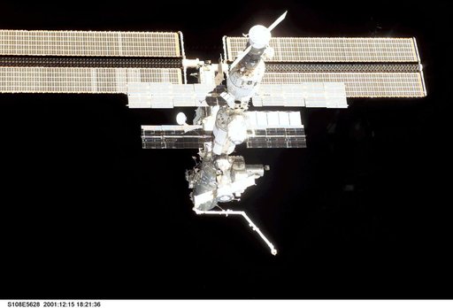 The nadir - aft side of the ISS taken during the STS-108 undocking and flyaround