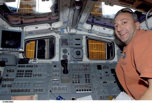STS-109 MS Massimino smiles for camera from aft flight deck