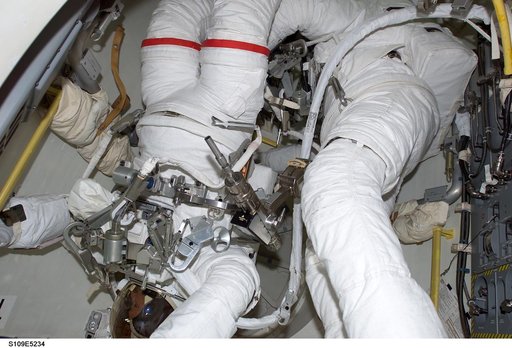 STS-109 MS Grunsfeld and Linnehan in airlock prior to EVA