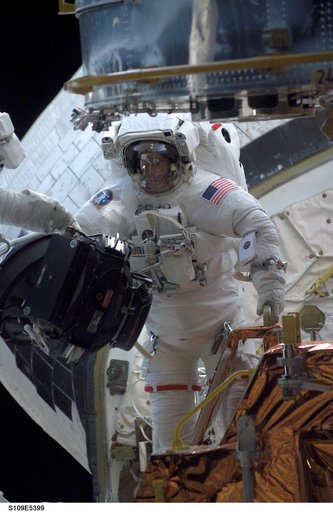 STS-109 MS Newman replace Reaction Wheel assembly during EVA 2