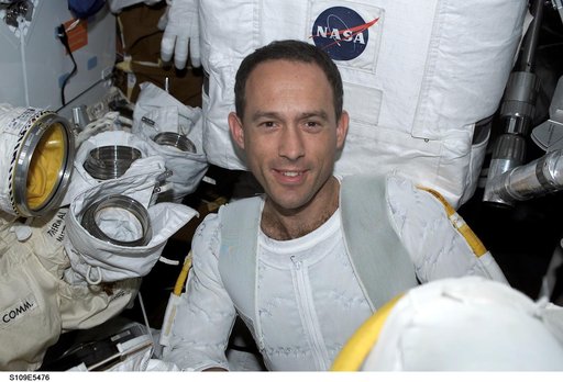 STS-109 MS Newman prepares for EVA 4 on middeck
