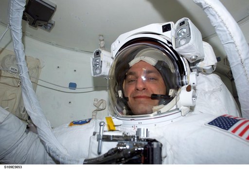 MS Linnehan  wearing EMU in airlock prepares for EVA 3