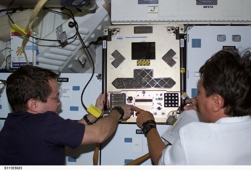Bursch and Chang-Diaz install the BPS in a slot on Endeavour's middeck for return on STS-111 UF-2