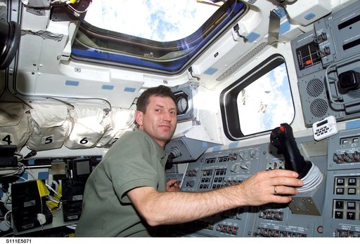 Treschev at Endeavour's AFD RMS controls during STS-111 UF-2