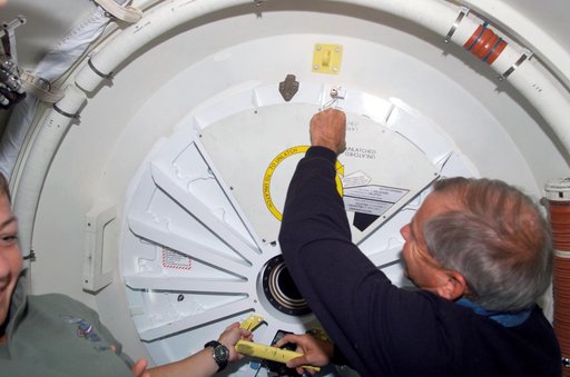 Cockrell prepares to open PMA 2 hatch to ingress the ISS U.S. Lab during mission STS-111 UF-2