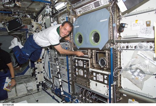 Perrin floats next to the MSG in the Destiny U.S. Lab during STS-111 UF-2 docked OPS