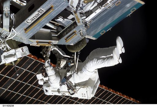 Perrin installs the MBS to the Mobile Transporter railcar during STS-111 UF-2 EVA 2