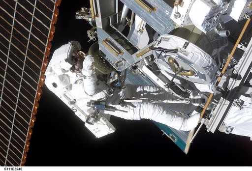Perrin installs the MBS to the Mobile Transporter railcar during STS-111 UF-2 EVA 2