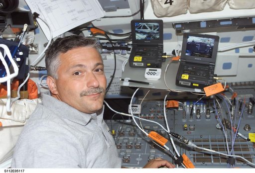 STS-112  MS Yurchikhin on flight deck with video players