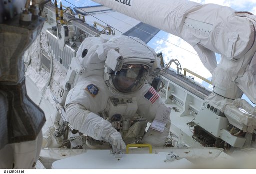 MS Sellers retrieves tool during EVA 2