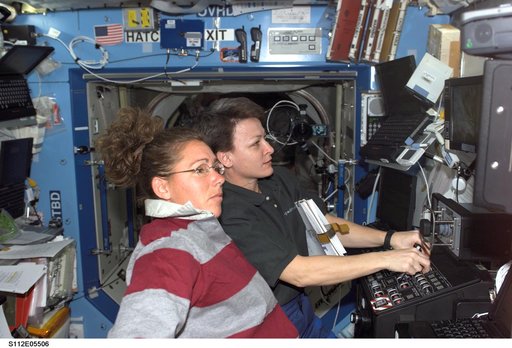 MS Magnus and Expedition 5 Science Officer Whitson at SSRMS controls
