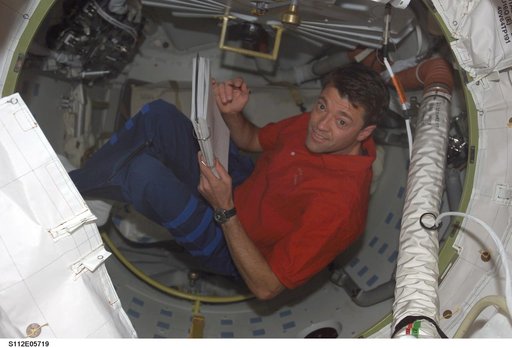 CDR Ashby with checklist on ISS