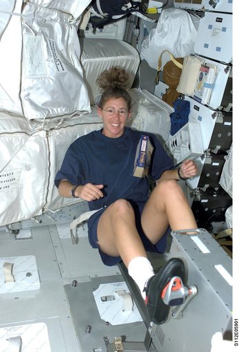 STS-112 MS Magnus exercises on ergometer on middeck