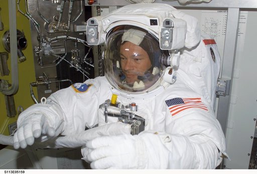 EVA Prep OPS - MS Lopez-Alegria donned in EMU for first EVA during STS-113