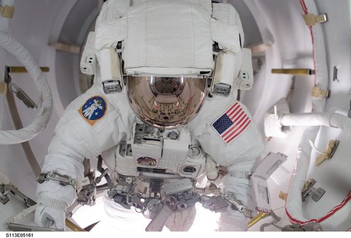 MS Herrington egresses Quest / AL for first EVA during STS-113