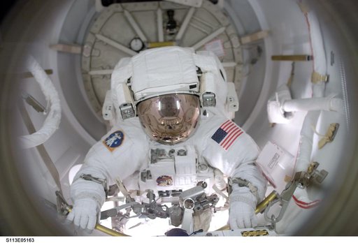MS Herrington egresses Quest / AL for first EVA during STS-113