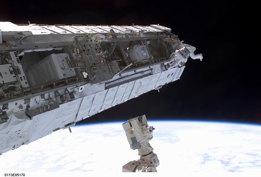 MS Lopez-Alegria and MS Herrington Keel Trunnion Pin OPS on P1 Truss during second EVA for STS-113