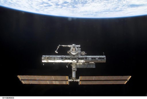 Overall exterior views of the ISS during Undocking and Flyaround Operations for STS-113 (11A)