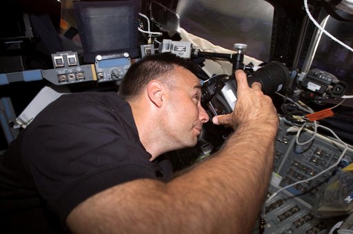 Archambault uses camera at the aft FD window during Joint Operations