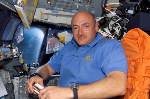 Kelly smiles at camera from the PLT seat on the FD during STS-121