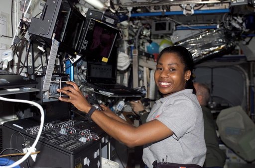 Wilson works at the SSRMS during STS-121 / Expedition 13 joint operations