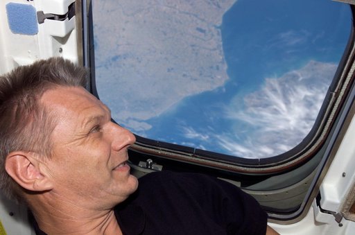 Sellers looks at the Earth from the orbiter AFD during STS-121 / Expedition 13 joint operations