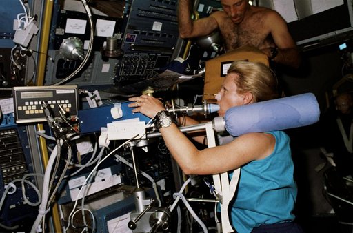 STS-40 Mission Specialist (MS) Seddon on ergometer conducts Exp. No. 066