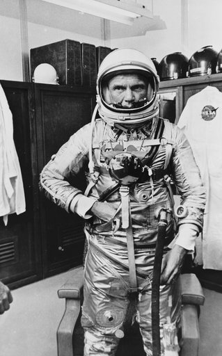 Astronaut John Glenn poses in Mercury Space Suit