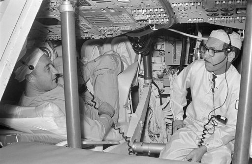 GRISSOM, VIRGIL I., ASTRONAUT - TRAINING - CREW CHECKS SPACECRAFT (S/C) EQUIPMENT - NORTH AMERICAN AVIATION, INC. (NAA), DOWNEY, CA