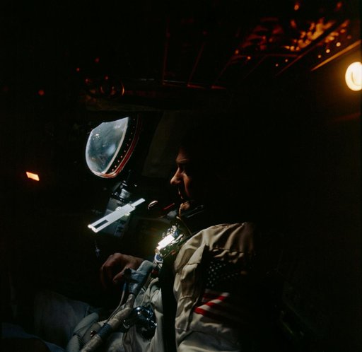 Astronaut Edwin Aldrin inside Gemini spacecraft cabin during flight