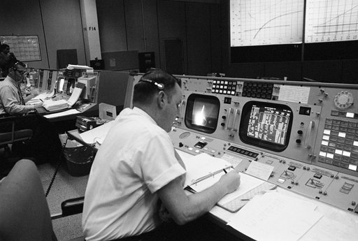 Clifford Charlesworth seated at his console in Mission Control Room