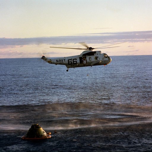 Apollo 10 crewmember is pickup by recovery helicopter