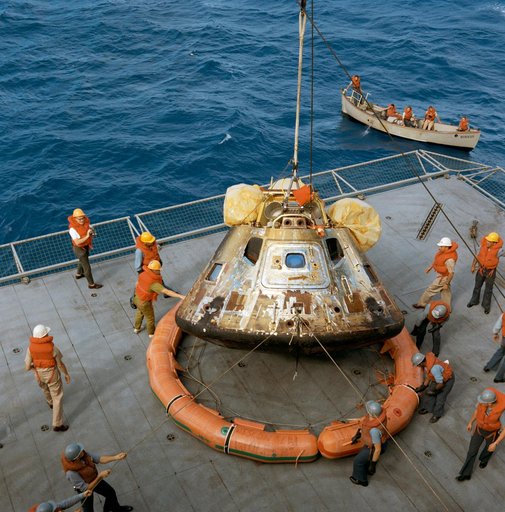 Apollo 11 spacecraft Command Module hoisted aboard U.S.S. Hornet