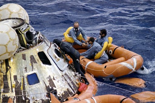Apollo 12 crew assisted with egressing command module after landing