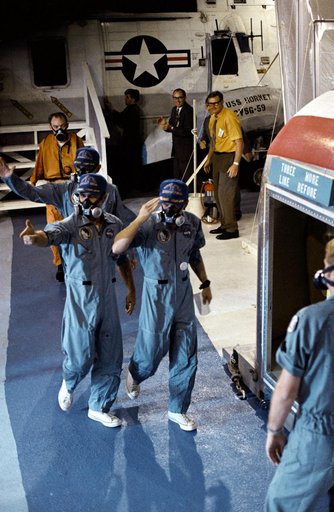 U.S.S. Hornet crewmen greeted by crew of Apollo 12 lunar landing mission
