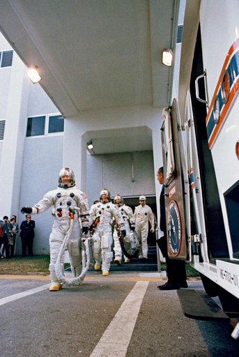 Apollo 9 crew leaves Spacecraft Operations Building during countdown