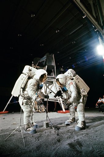 Apollo 11 crewmembers participates in simulation of moon's surface
