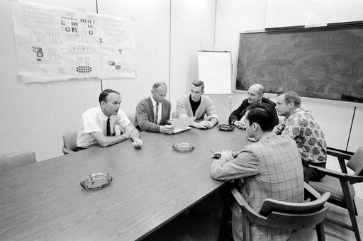 Apollo 10 and 11 crews photographed during Apollo 10 debriefing