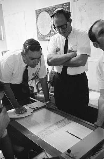 Dr. Garry Latham studies seismometer tracings from the moon